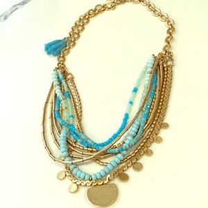 Gold and turquoise multi layer necklace.